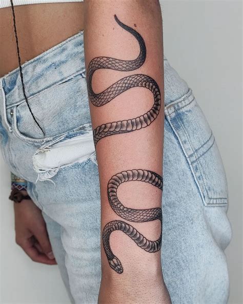 wrap around snake tattoo arm|Snake Arm Tattoo Ideas for a Fierce Look